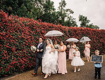 Marry Me Marilyn_Samantha_Michael_Wedding Tamborine Gardens Outside Chapel with Umbrellas